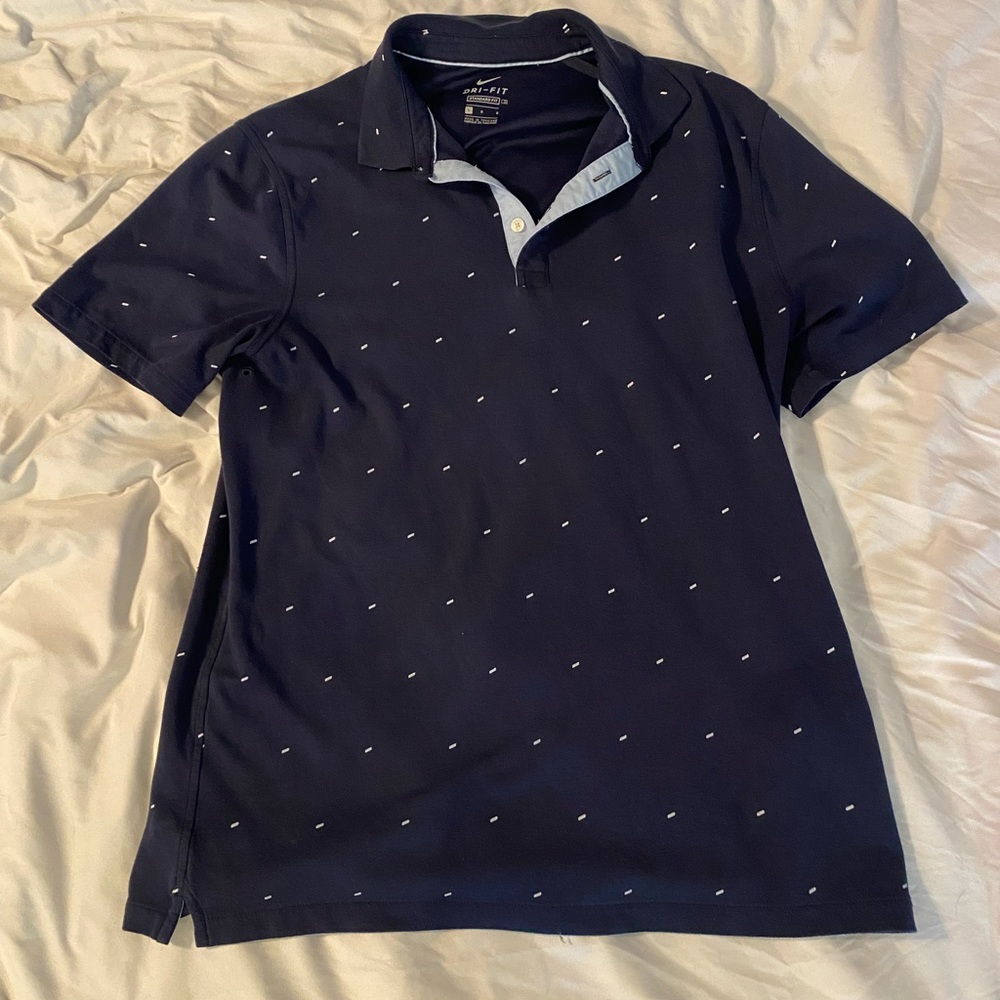 This is a Nike standard fit dry fit collared shirt